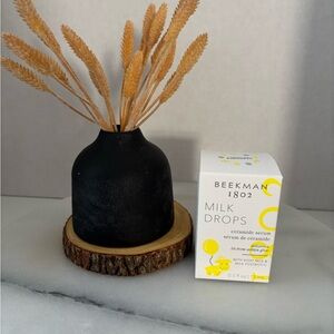 Beekman 1802 Milk Drops Serum with Black Vase